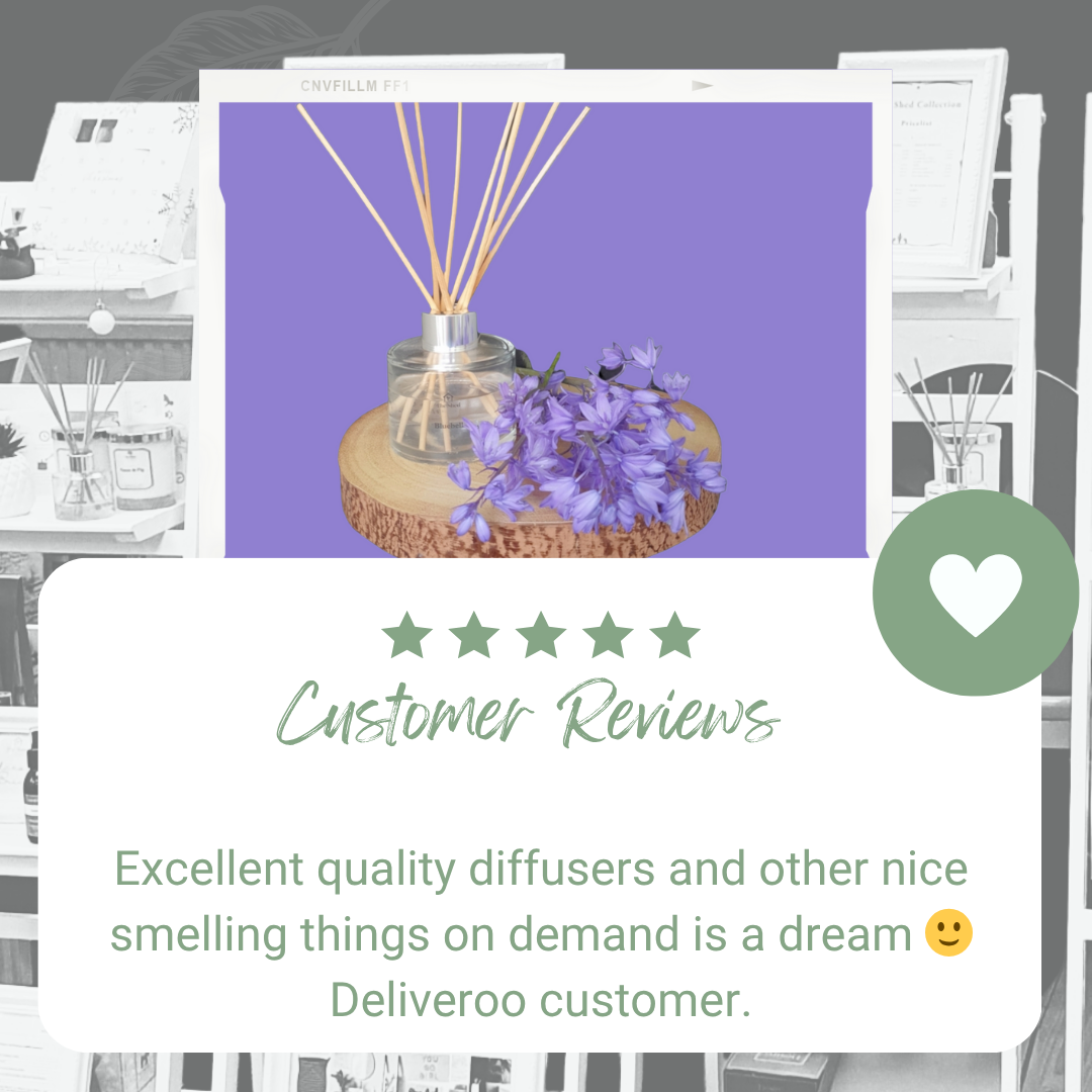 Five-star customer review for The Shed Collection's diffusers with a Bluebell diffuser and flowers on a log slice.