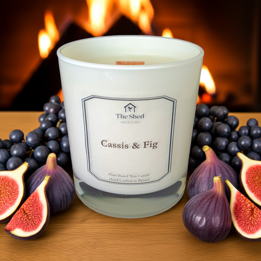 Candle surrounded by Cassis & Figs wih open fire in background