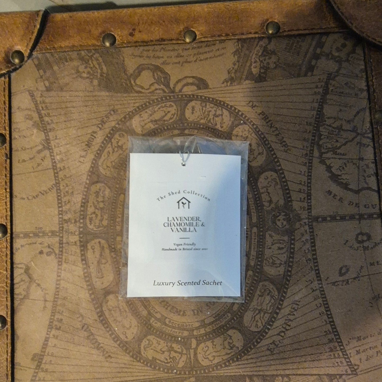 Lavender, Chamomile & Vanilla scented sachet on a decorative map background