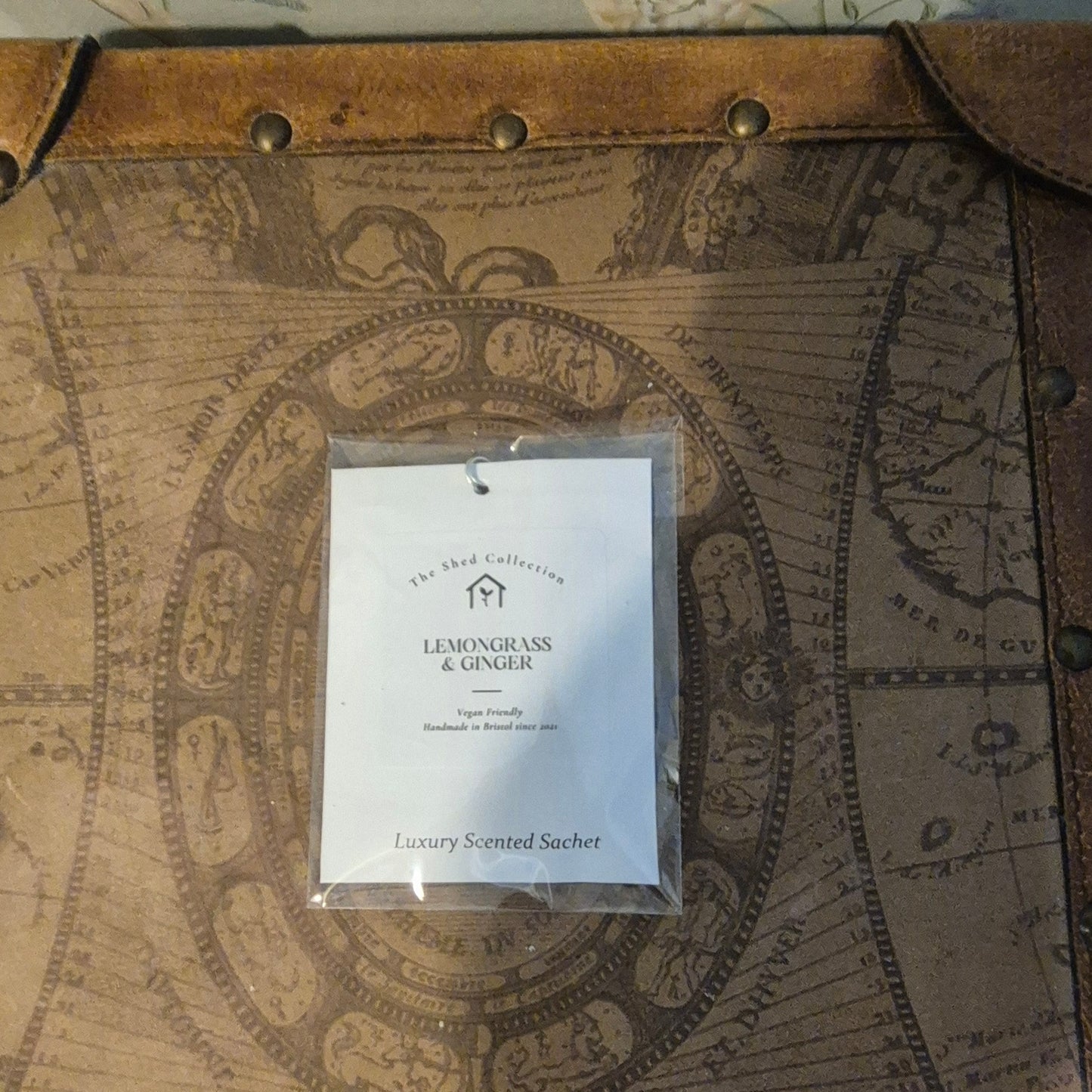 Lemongrass & Ginger scented sachet on a vintage map background