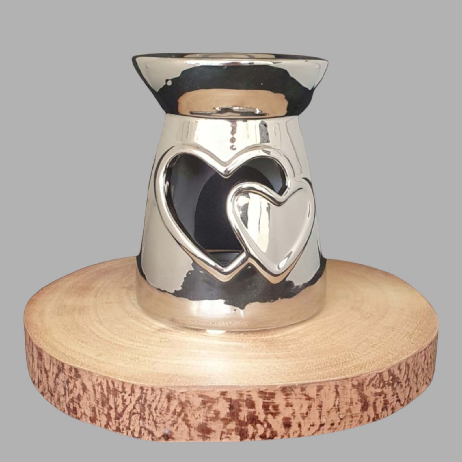 Silver Wax Burner on log slice