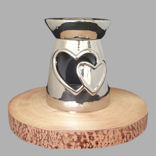 Silver Wax Burner on log slice
