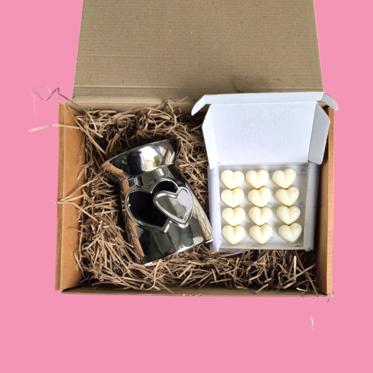  Silver Wax Burner in a wood wool lined box with an open Box of heart shaped wax melts