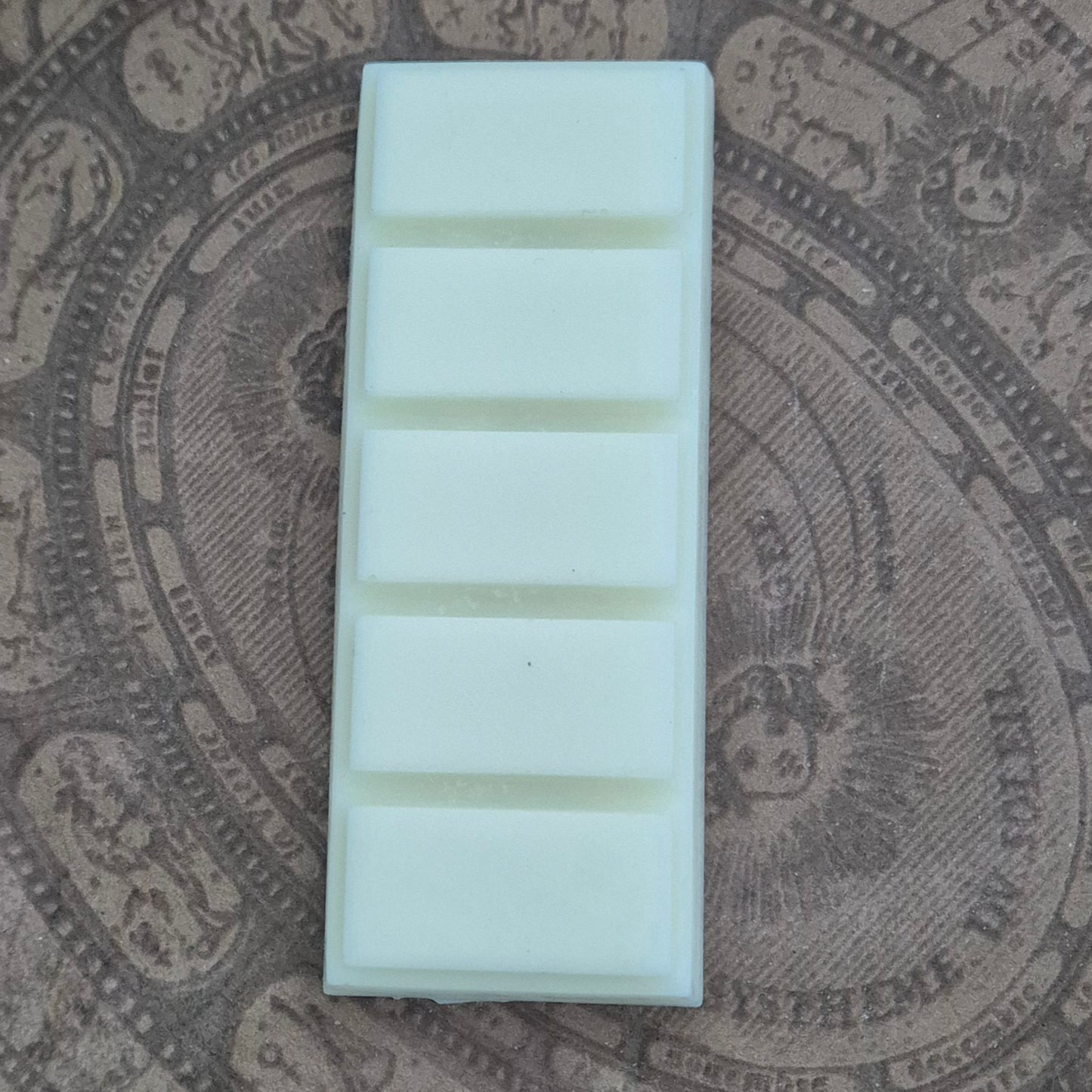 Unpackaged soy snap bar on vintage background