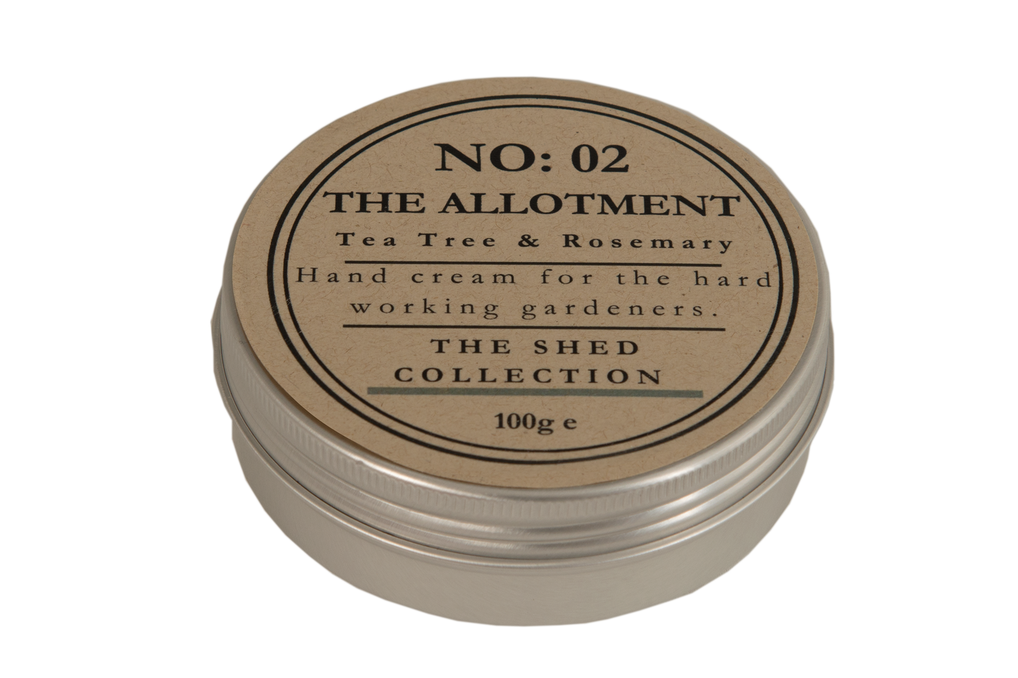 A round metal tin of hand cream with a kraft paper label reading 'NO: 02 THE ALLOTMENT Tea Tree & Rosemary Hand cream for the hard working gardeners. THE SHED COLLECTION 100g e'.