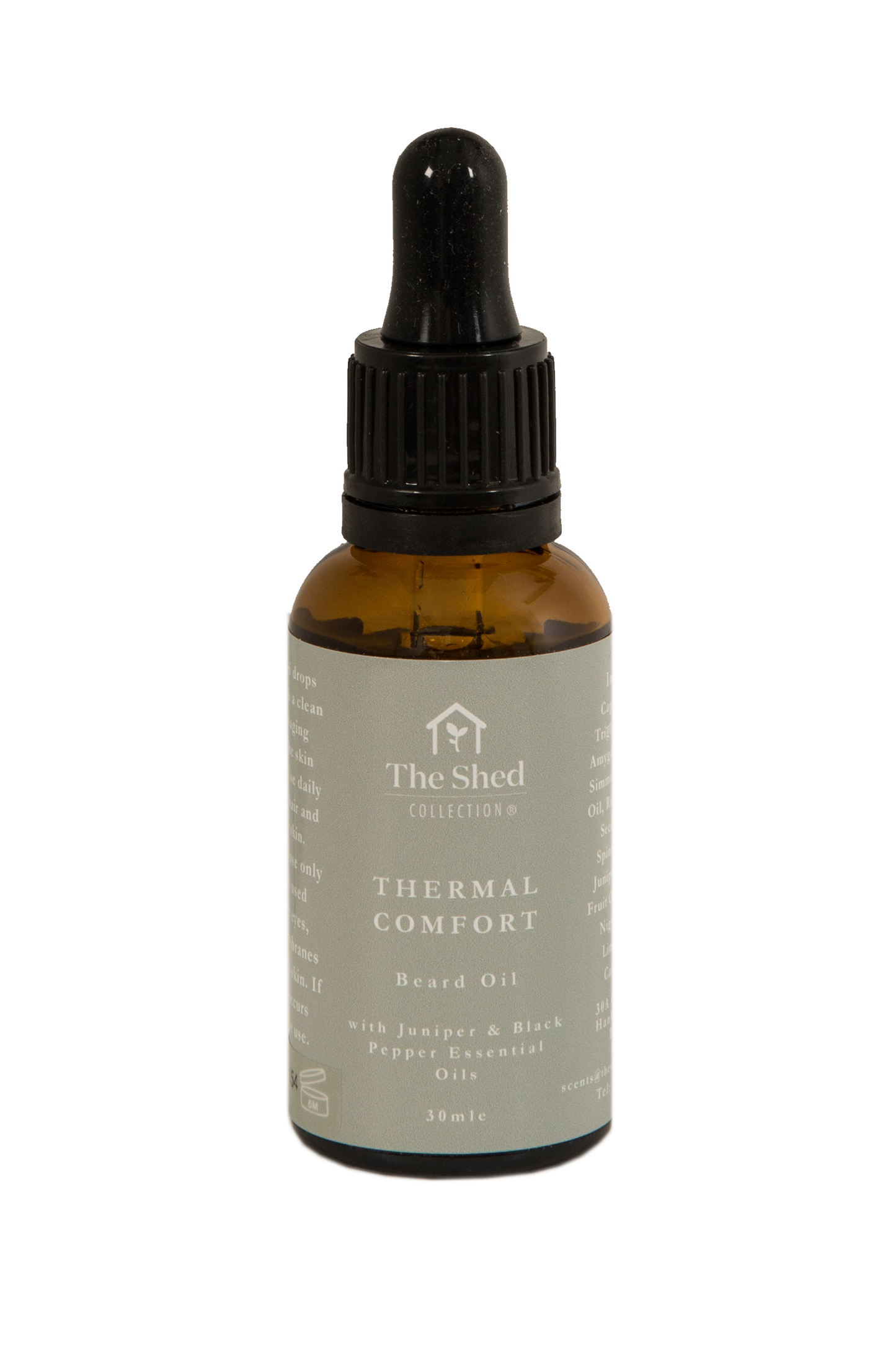 A 30ml amber glass dropper bottle of Thermal Comfort- Black Pepper & Juniper beard oil by The Shed Collection, featuring a black dropper cap and a light green label with white text.