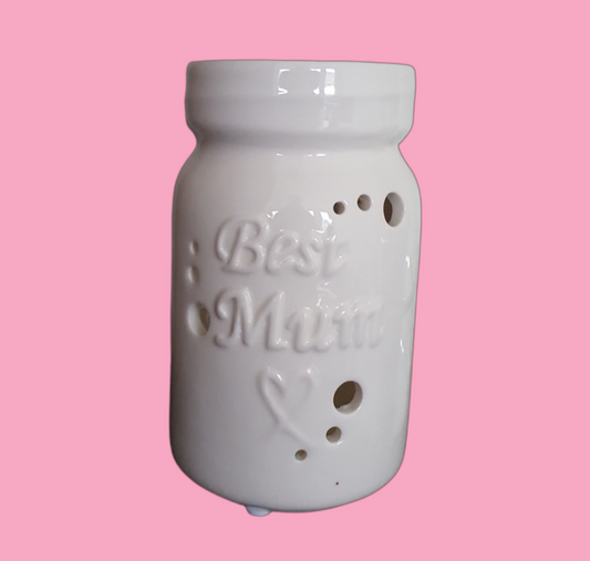 A white ceramic wax burner with 'Best Mum' inscribed on the front, featuring a design with holes on the top and side.
